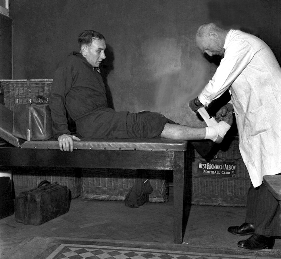 19-1949-Fred Reed treats the injured Billy Elliott.